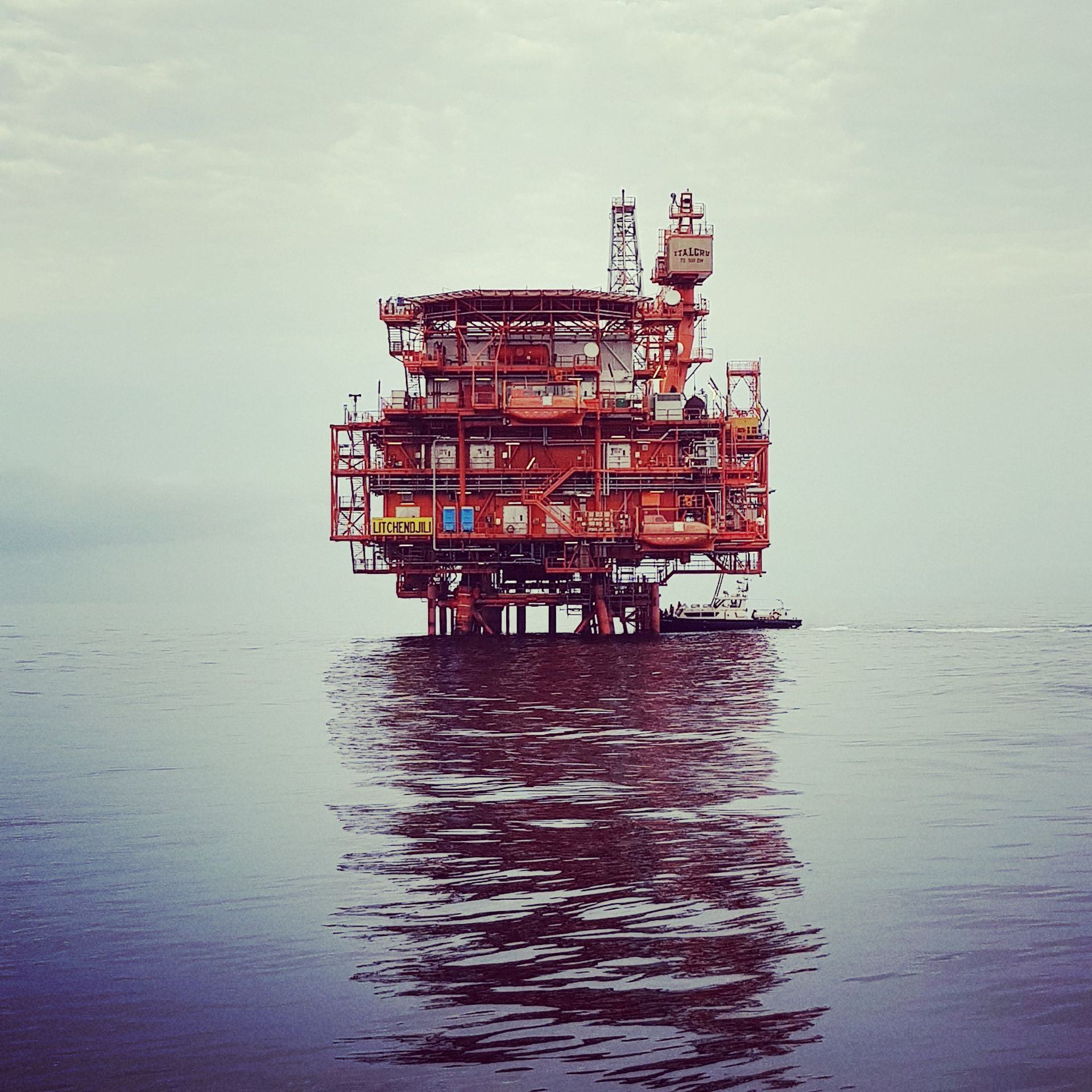 Offshore oil and gas platform standing in calm water